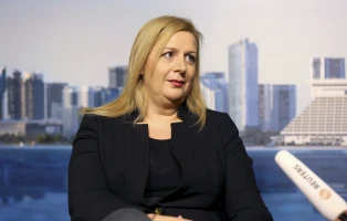 Suha Arafat, wife of late Palestinian leader Yasser Arafat, speaks with Reuters in Doha November 6, 2013. Arafat was poisoned to death in 2004 with radioactive polonium, his widow Suha said on Wednesday after receiving the results of Swiss forensic tests on her husband's corpse. REUTERS/Fadi Al-Assaad