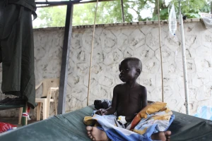 A South Sudanese child suffering from cholera sits on a bed in Juba Teaching Hospital in Juba, May 27, 2014.  (Photo: Reuters)