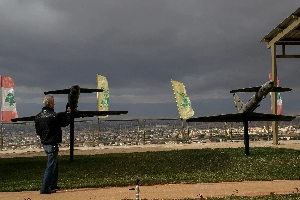 A visitor takes mobile images of drones displayed along with other heavy military displayed at pro-Iranian Hezbollah "Jihadi Museum" in the city of Baalbek (Photo: Marwan Naamani/dpa via Reuters Connect).