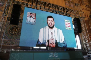 Houthi leader Abdul-Malik al-Houthi addresses followers via a video link at the al-Shaab Mosque, formerly al-Saleh Mosque, in Sanaa, Yemen February 6, 2024. REUTERS/Khaled Abdullah