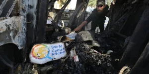 Palestinians inspect the heavily damaged vehicles after the attacks target officials working at the US-based international volunteer aid organization World Central Kitchen WCK, in Dair El-Balah, Gaza Strip, on April 02, 2024 (Photo: Omar Ashtawy apaimages/via REUTERS).