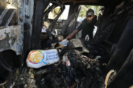 Palestinians inspect the heavily damaged vehicles after the attacks target officials working at the US-based international volunteer aid organization World Central Kitchen WCK, in Dair El-Balah, Gaza Strip, on April 02, 2024 (Photo: Omar Ashtawy apaimages/via REUTERS).