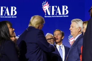 U.S. President Donald Trump speaks with Faith & Freedom Coalition founder Ralph Reed at the National Faith Advisory Summit in Powder Springs, Georgia, on October 28, 2024. REUTERS/Brendan McDermid.