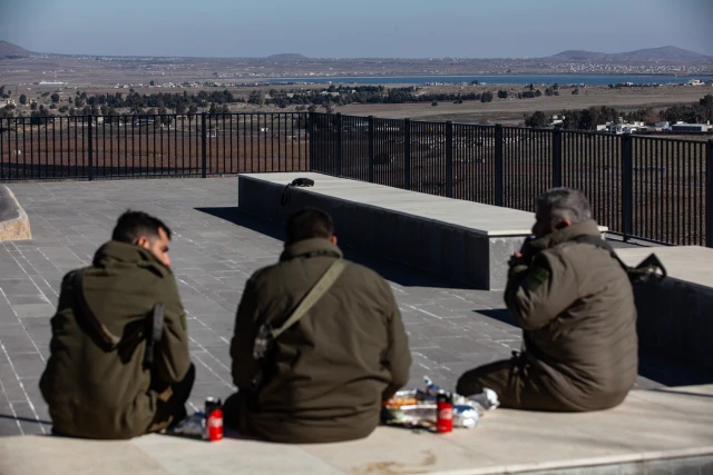 Israeli soldiers at a lookout point next to the boundary fence delineating the UN-patrolled buffer zone between Israel and Syria in the Golan Heights, on December 15, 2024. (Photo by Mati Milstein/NurPhoto)