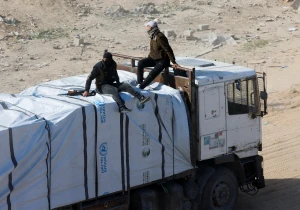 Illustration: Gunmen in Gaza seen on humanitarian aid trucks. Rafah, southern Gaza Strip, January 21, 2025. REUTERS/Mohammed Salem
