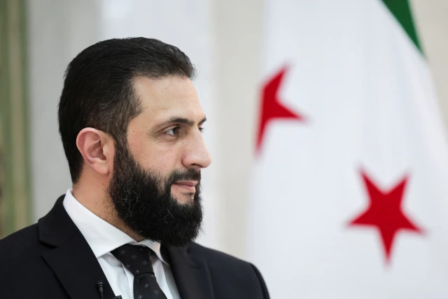 Syria’s interim President Ahmed al-Sharaa attends an interview with Reuters at the presidential palace, in Damascus, Syria March 10, 2025. REUTERS