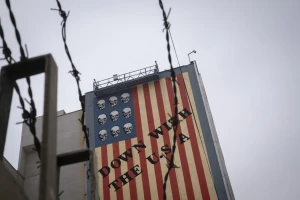 An anti-U.S. mural appears on a wall of a governmental building in downtown Tehran, Iran, on April 12, 2025, during the day of the Iran-U.S. nuclear discussions. According to Iranian officials, indirect nuclear discussions between Iran and the United States begin in Muscat, Oman, on April 12. (Photo by Morteza Nikoubazl/NurPhoto via Reuters Connect)