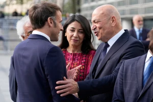 French President Emmanuel Macron, shakes hands with Hani al-Hayek, the Palestinian Authority's minister for heritage and tourism, before visiting the exhibition "Treasures rescued from Gaza", at the Arab World Institute (IMA) in Paris, France April 14, 2025. Michel Euler/Pool via REUTERS