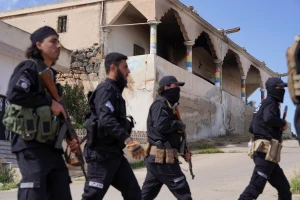 Members of Syrian security forces patrol after being deployed in the village of Al-Soura al-Kubra, following clashes between Sunni Islamist militants and Druze fighters, in Sweida province, Syria, May 2, 2025. REUTERS/Karam Al-Masri