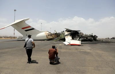Members of the media take pictures of a destroyed plane at Sanaa International Airport, in the aftermath of an Israeli airstrike, in Sanaa, Yemen, May 7, 2025. REUTERS/Khaled Abdullah