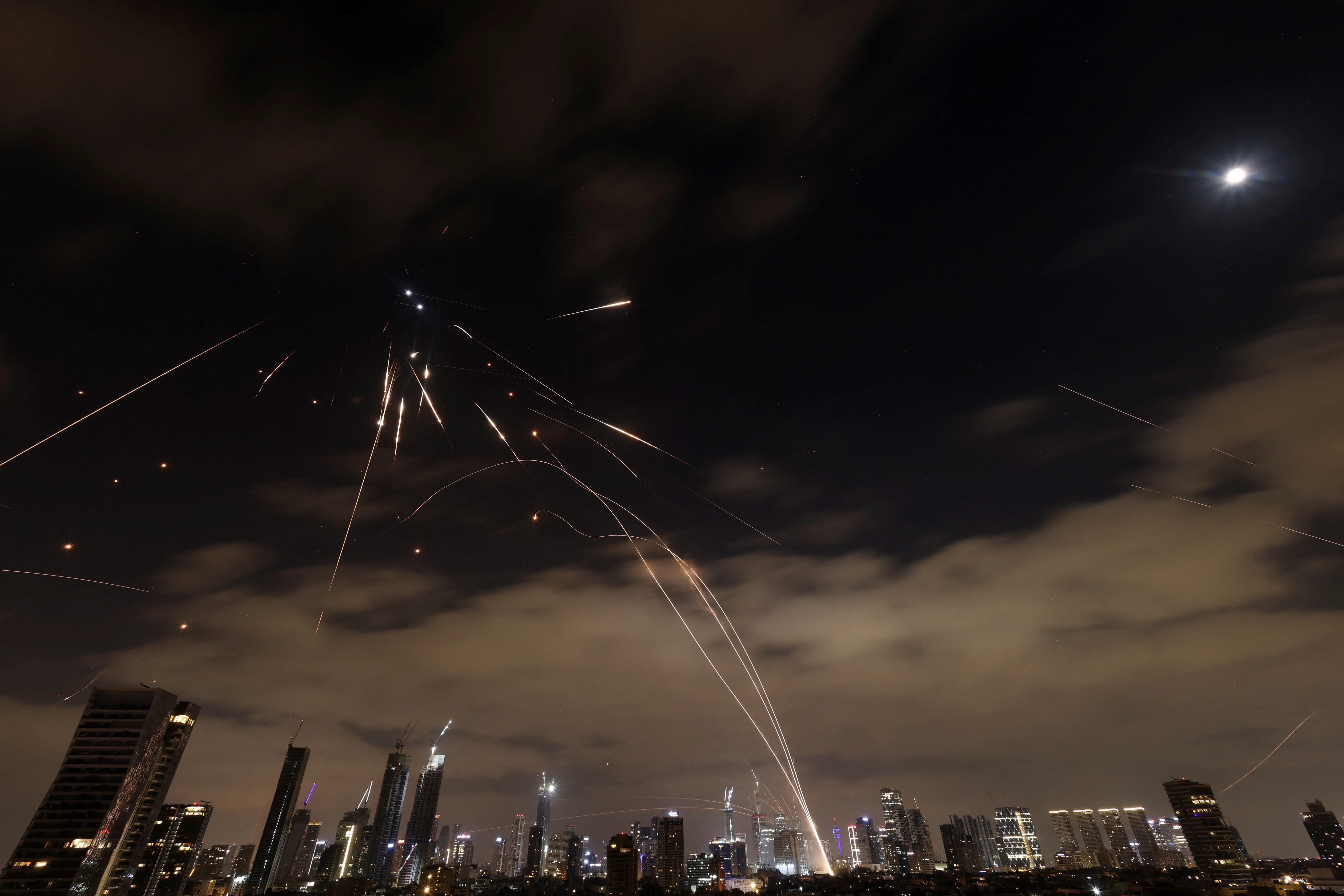 Missiles launched from Iran are intercepted as seen from Tel Aviv, Israel, June 16, 2025. REUTERS/Ronen Zvulun