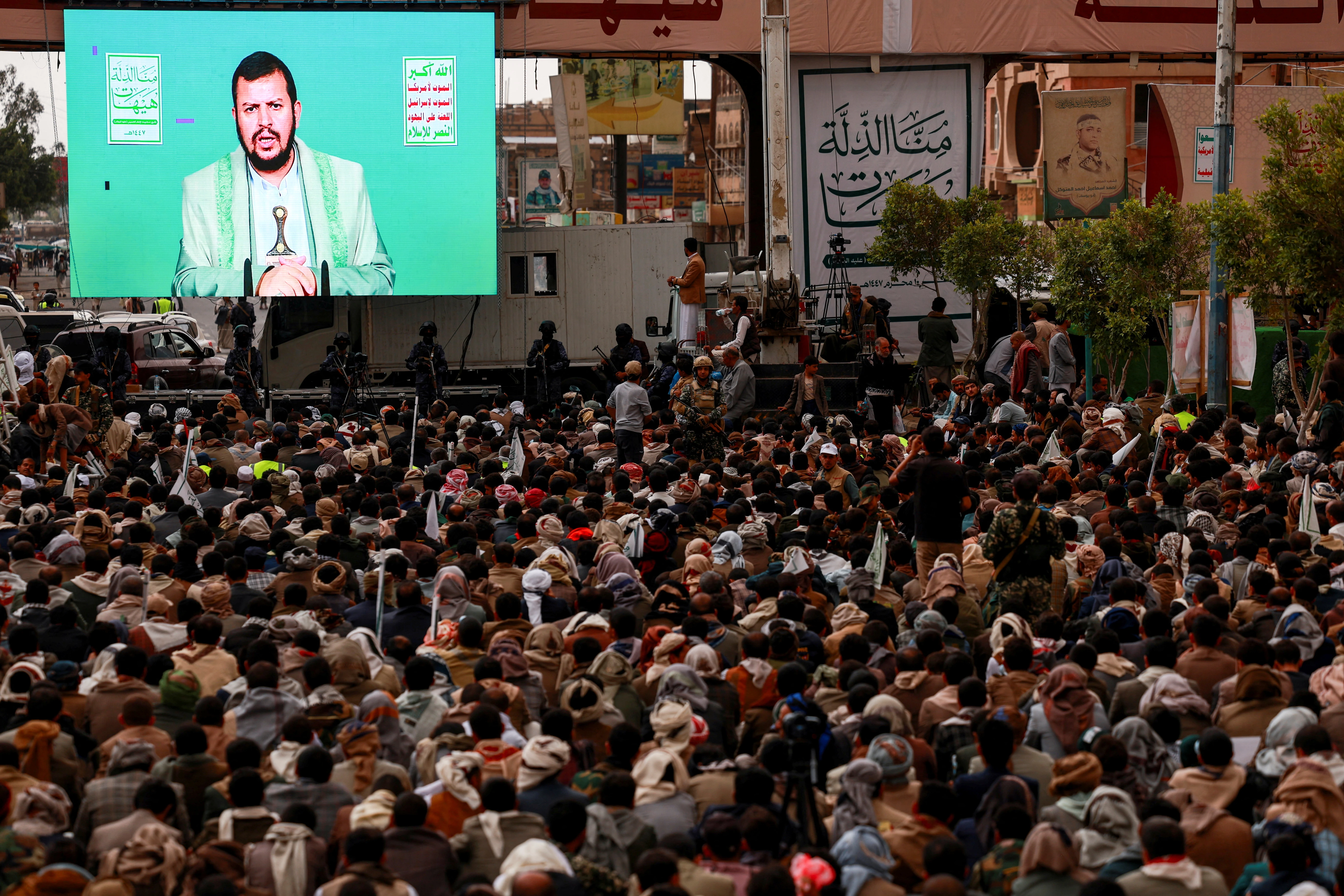 Supporter of Yemen's Houthi movement watch a speech by the movement's leader Abdul-Malik al-Houthi displayed on a big screen, during a rally marking the Ashura day, on which Shi'ite Muslims commemorate the martyrdom of Imam Hussein, the grandson of the Prophet Muhammad, in Sanaa, Yemen July 6, 2025. Photo: Reuters Connect by Khaled Abdullah