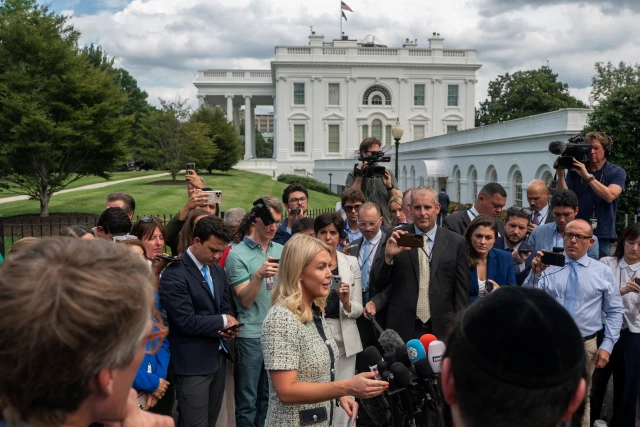 White House Press Secretary Karoline Leavitt speaks with members of the media outside of the White House in Washington, D.C., U.S., July 21, 2025. REUTERS/Nathan Howard