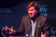 Former Fox News host Tucker Carlson speaks Tuesday, Oct. 21, 2025, during a Turning Point USA tour stop at the Indiana University Auditorium in Bloomington. Photo: Reuters Connect