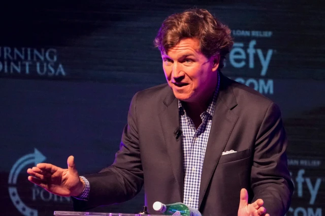 Former Fox News host Tucker Carlson speaks Tuesday, Oct. 21, 2025, during a Turning Point USA tour stop at the Indiana University Auditorium in Bloomington. Photo: Reuters Connect