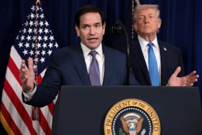 U.S. Secretary of State Marco Rubio speaks as U.S. President Donald Trump stands behind him during a press conference following a U.S. strike on Venezuela where President Nicolas Maduro and his wife, Cilia Flores, were captured, from Trump's Mar-a-Lago club in Palm Beach, Florida, U.S., January 3, 2026. Photo: Jonathan Ernst via Reuters Connect
