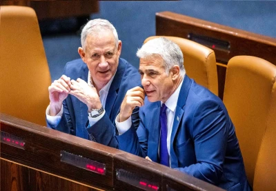 Minister of Defense Benny Gantz and Minister of Foreign Affairs Yair Lapid during a discussion and a vote on a bill to dissolve the Knesset, at the assembly hall of the Israeli parliament, in Jerusalem, on June 22, 2022 (Original photo: Olivier Fitoussi/Flash90).