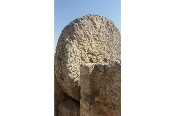 The rolling stone that was used to seal the entrance of the Susya synagogue (Photo: Aaron Goel-Angot).