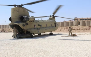 A Task Force Phoenix CH-47 Chinook helicopter from B Company, 1st Battalion, 171st Aviation Regiment (General Support Aviation Battalion), sits on the landing pad at a forward operating base in Syria. (Photo: Jason Sweeney/U.S. Army)