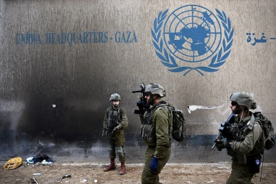 Israeli soldiers operate next to the UNRWA headquarters, amid the ongoing conflict between Israel and the Palestinian Islamist group Hamas, in the Gaza Strip, February 8, 2024. REUTERS/Dylan Martinez