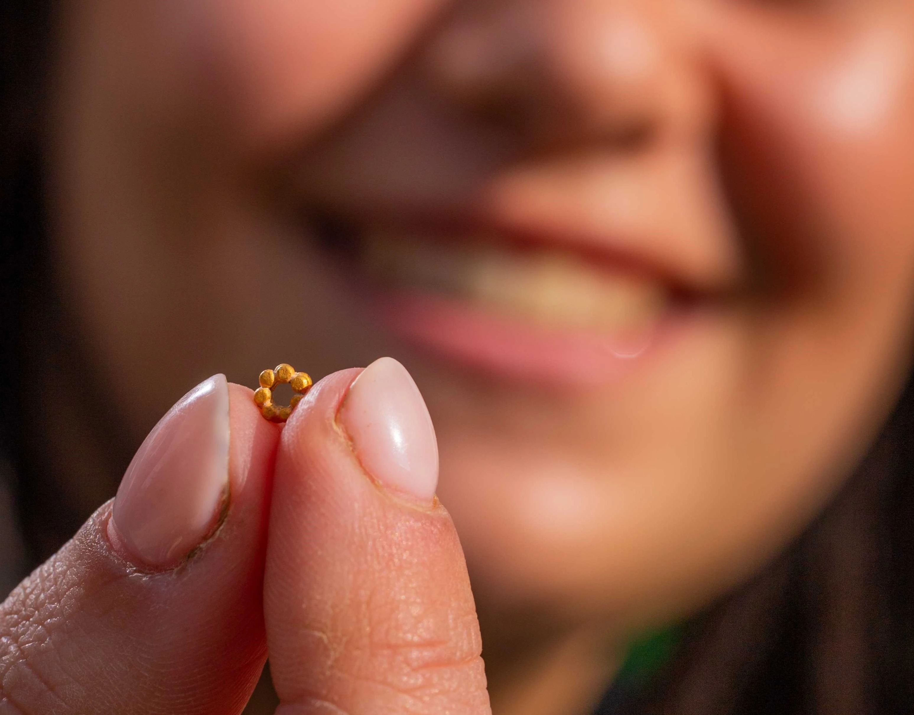 3.	Hallel Feidman with the rare gold bead. Credit: Koby Harati, City of David