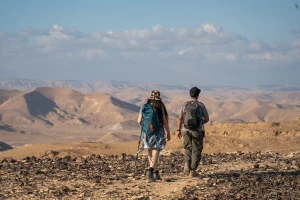 Travelers hike in Har Karkom, in the southwest Negev desert, on December 21, 2022. Photo by Yaniv Nadav/Flash90