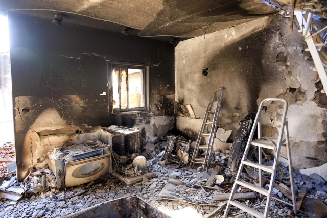 Illustrative - Destruction by Hamas terrorists on Oct. 7 at Kibbutz B'eri, southern Israel, December 19, 2023. (Photo by Moshe Shai/Flash90)