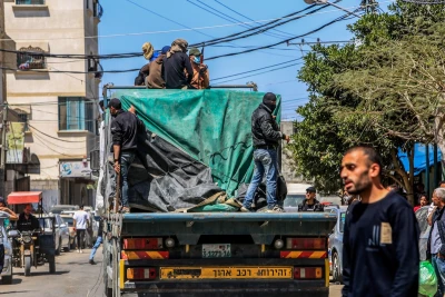 Armed and masked Palestinians seen on trucks loaded with international humanitarian aid entering Gaza through the Israeli Kerem Shalom crossing, in southern Gaza, April 3, 2024. (Photo: Abed Rahim Khatib/Flash90)