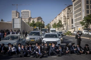 Ultra-Orthodox Jews block a road in a protest against the drafting of ultra-Orthodox Jews to the Israeli army, outside the Supreme Court in Jerusalem, June 2, 2024. (Photo: Chaim Goldberg/Flash90)
