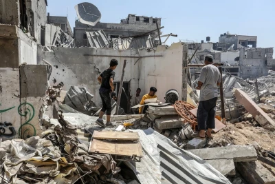 Palestinians seen near the destruction after the Israeli army withdrew its forces in east of Bureij camp in the central Gaza Strip, on June 12, 2024. Photo by Abed Rahim Khatib/Flash90
