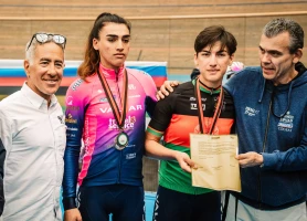 Afghanistan's national cycling champion Fariba Hashimi (2R) and her sister Yulduz (2L) receive their contracts from the owner of Women’s WorldTour team Israel – Premier Tech Roland, Sylvan Adams, in Aigle, Switzerland, October 23, 2022. (Photo: Israel – Premier Tech/Twitter)