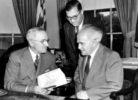 President Harry S. Truman accepting a gift from Prime Minister David Ben-Gurion (seated) and Ambassador H.E. Abba Eban of Israel. (photo credit: Truman Presidential Library)