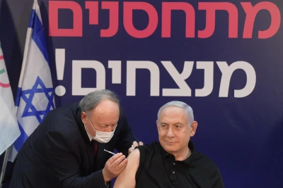 Prime Minister Benjamin Netanyahu gets vaccinated for COVID-19. (Photo: Amos Ben-Gershom/GPO)