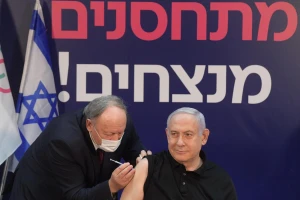 Prime Minister Benjamin Netanyahu gets vaccinated for COVID-19. (Photo: Amos Ben-Gershom/GPO)