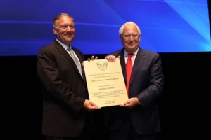 Former U.S. Ambassador to Israel David Friedman presents an award to former U.S. Secretary of State Mike Pompeo at the gala opening of The Friedman Center, Oct. 11, 2021. (Photo: Friedman Center Twitter feed, photographer Shauli Landner)