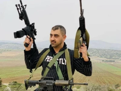 Palestinian doctor, Abdullah Abu Tin, who was reportedly a member of the Al-Aqsa Martyrs Brigades, is seen holding several assault rifles in an undated photo circulated online after his death during a clash with IDF soldiers, Oct. 14, 2022. (Photo: Twitter)