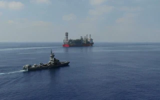 An Israeli Sa'ar Class 4.5 missile boat guards the Energean floating production, storage and offloading vessel at the Karish gas field, in footage published by the military on July 2, 2022. (Israel Defense Forces)