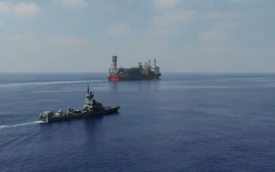 An Israeli Sa'ar Class 4.5 missile boat guards the Energean floating production, storage and offloading vessel at the Karish gas field, in footage published by the military on July 2, 2022. (Israel Defense Forces)