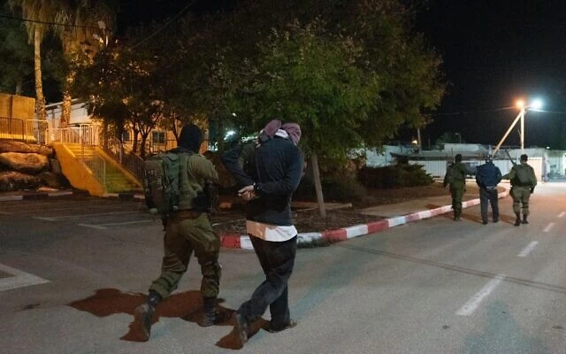 Israeli special forces arrest two men suspected of being part of the cell that carried out a deadly shooting attack in the West Bank, December 19, 2021. (Photo: Israel Defense Forces)
