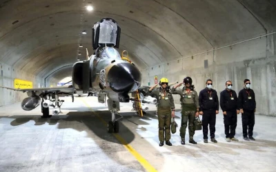 Pilots pose with an aircraft at a new underground Iranian air force base in this picture released February 7, 2023 (Iranian Army)