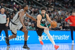 Jan 3, 2026; San Antonio, Texas, USA; Portland Trail Blazers forward Deni Avdija (8) dribbles past San Antonio Spurs forward Harrison Barnes (40) in the second half at Frost Bank Center. Mandatory Credit: Daniel Dunn-Imagn Images