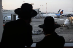 Ultra orthodox Jewish men make there way to Uman, Ukraine, for the Jewish holiday of Rosh Hashanah at the Ben Gurion international airport in Tel Aviv. Thousands of Jewish worshippers are expected to visit the grave of Rabbi Nachman of Breslov in Uman during the holiday of Rosh Hashanah. September 02 2013. Photo by Yaakov Naumi/Flash90