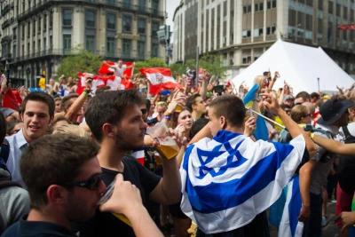 Israelis wear the Israeli flag in central Brussels on their way to the music festival Tomorrowland which took places in Boom, Belgium. July 23, 2015. Photo by Johanna Geron/FLASH90