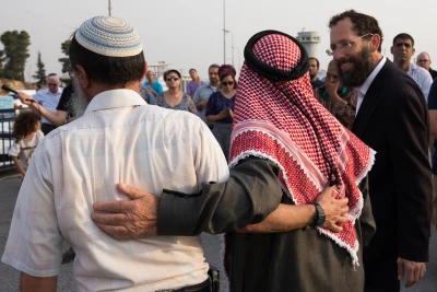 Illustration: Jews and Muslims attend a special prayer at the Gush Etzion junction, August 2, 2015. (Photo: Nati Shohat/Flash90)
