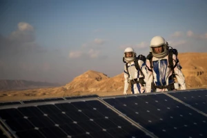 Israeli scientists walking near solar panels during a project simulates life in Mars, outside Mitzpe Ramon, Southern Israel, February 18, 2018, the D-MARS project is a a space analog research center in Israel, its founded by Israeli Space Agency and the Israeli Ministry of Science, Technology and Space. Photo by Yonatan Sindel/Flash90
