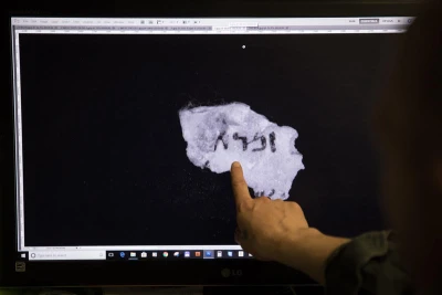 maging technician and camera operator, Shay Halevy, shows on screen fragments of a newly discovered script found by Israel Antiquities Authority researcher, Oren Abelman, in "Cave 11" near Qumran, at the IAA department in the Israel Museum, Jerusalem, on May 2, 2018. The fragments are now readable through advanced imaging equipment which can reveal letters that are invisible to the naked eye, at the Dead Sea Scrolls' conservation labs of the authority. Photo by Hadas Parush/Flash90