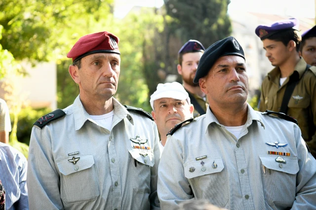 Major General Eyal Zamir, incoming Chief of Staff (R), and Major General Herzi Halevi, outgoing Chief of Staff (L), attend a memorial ceremony at the military cemetery in Kfar Saba on August 6, 2019.