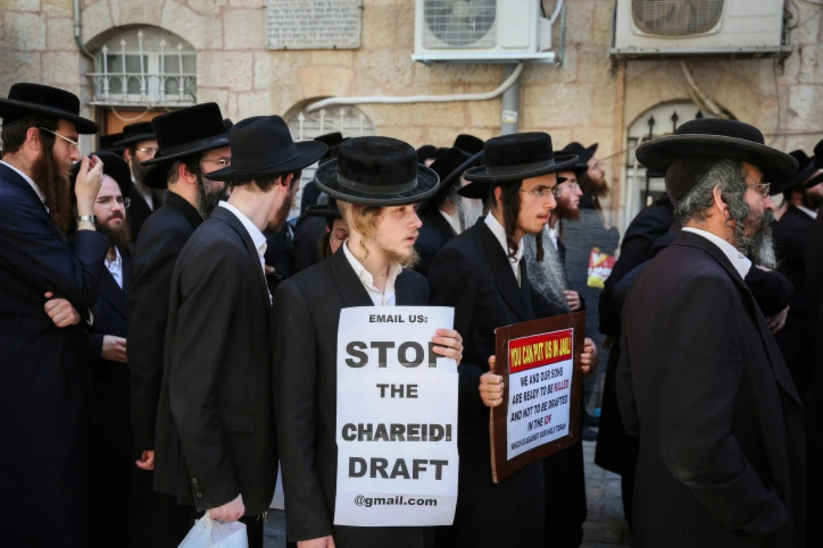 Ultra-Orthodox Jewish men march in protest of the Israeli army mandatory draft. August 13, 2019 (Photo by Flash90).