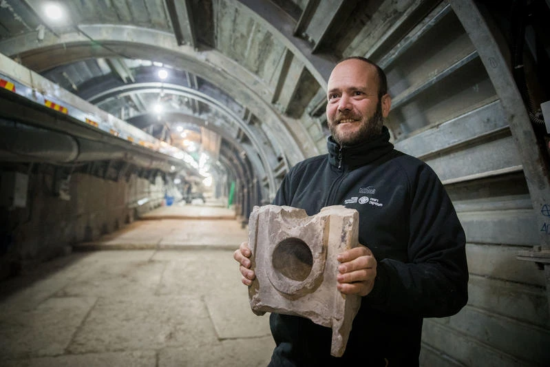 Israel Antiquities Authority Archaeologist Ari Levi holds a 2000-year-old measuring table found at the Pilgrimage Road at the City of David, in the East Jerusalem neighborhood of Silwan, on January 6, 2020. Photo by Yonatan Sindel/Flash90