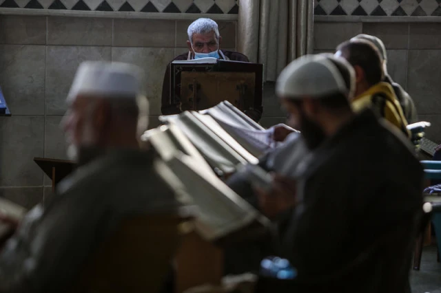 Palestinians read the Quran during the holy month of Ramadan at Al-Abrar mosque in Rafah, in the southern Gaza Strip, on April 17, 2021. Photo by Abed Rahim Khatib/Flash90